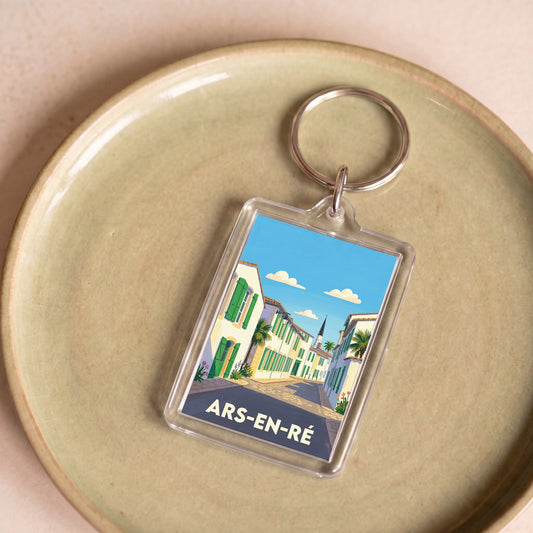 Porte-clés souvenir de la ville d'Ars-en-Ré avec une illustration stylisée.