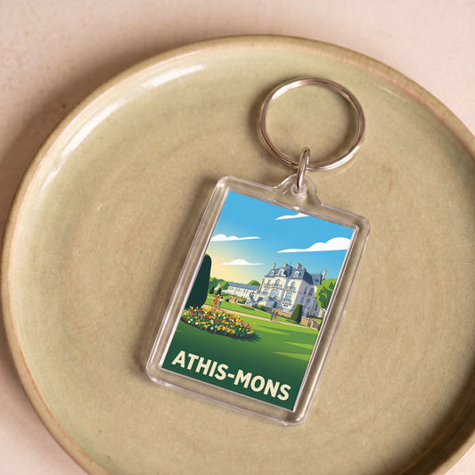 Porte-clés souvenir de la ville d'Athis-Mons avec une illustration stylisée.