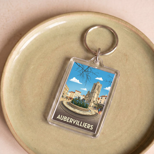 Porte-clés souvenir de la ville d'Aubervilliers avec une illustration stylisée.