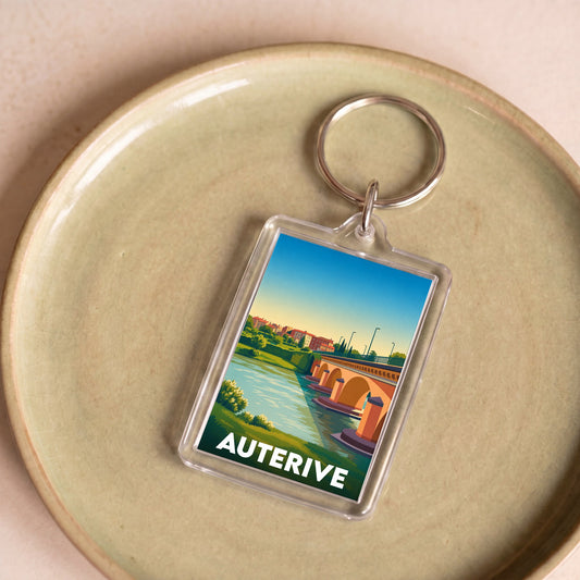 Porte-clés souvenir de la ville de Auterive avec une illustration stylisée de son pont.