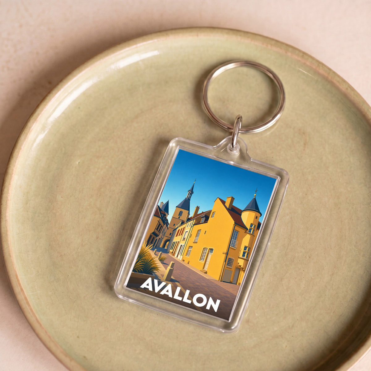 Porte-clés souvenir de la ville de Avallon avec une illustration stylisée.