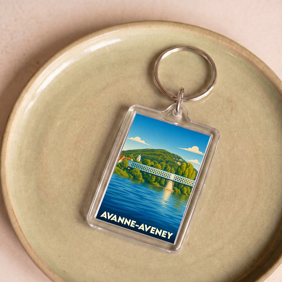 Porte-clés souvenir de la ville d'Avanne-Aveney avec une illustration stylisée de son pont sur le Doubs.
