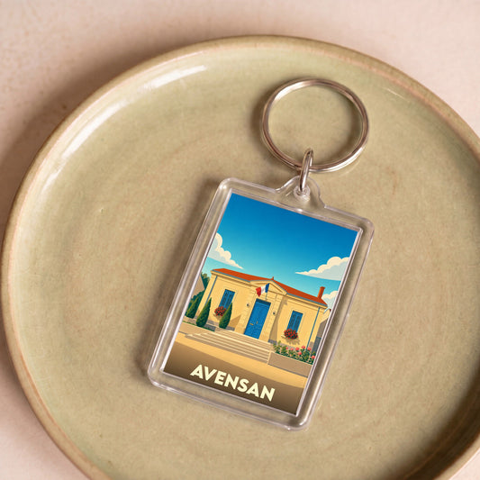 Porte-clés souvenir de la ville de Avensan avec une illustration stylisée.