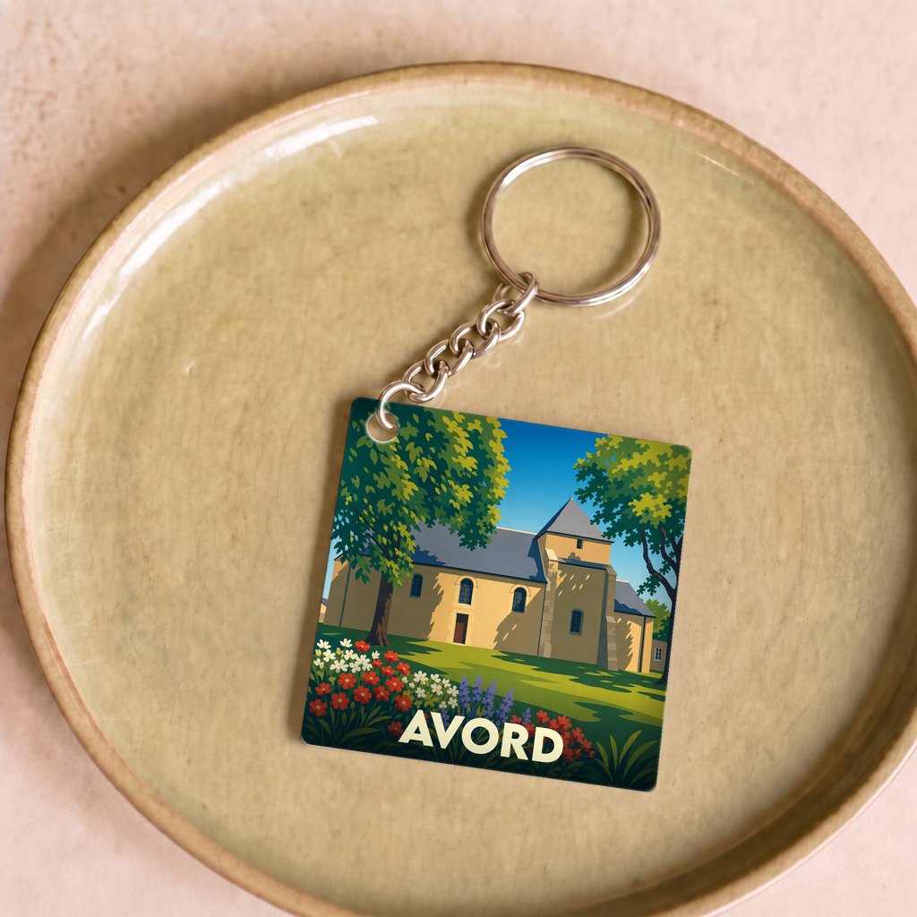 Porte-clés souvenir de la ville d'Avord avec une illustration stylisée de son église.