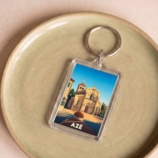 Porte-clés souvenir de la ville d'Azé avec une illustration stylisée de son église.