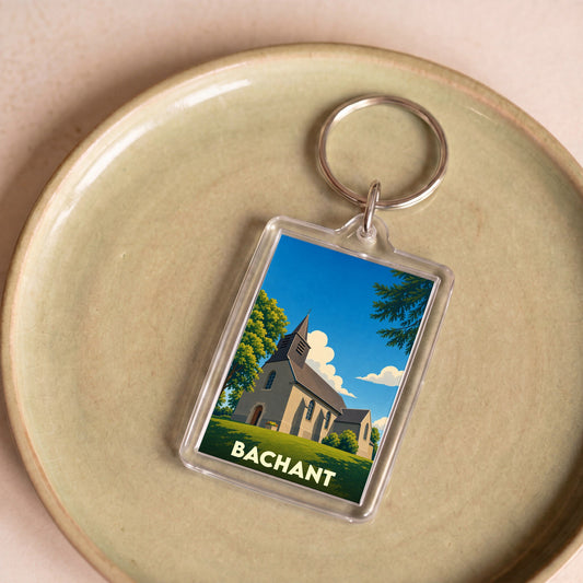 Porte-clés souvenir de la ville de Bachant avec une illustration stylisée de son église.