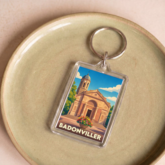 Porte-clés souvenir de la ville de Badonviller avec une illustration stylisée de son église.
