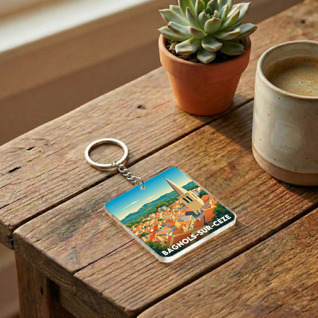 Porte-clés souvenir de la ville de Bagnols-sur-Cèze avec une illustration stylisée.