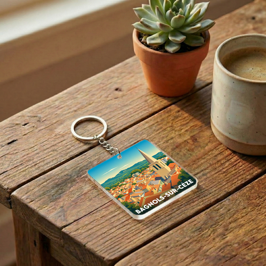 Porte-clés souvenir de la ville de Bagnols-sur-Cèze avec une illustration stylisée.
