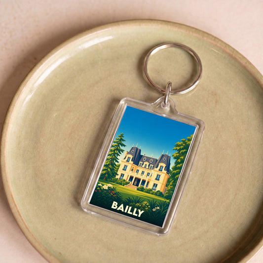 Porte-clés souvenir de la ville de Bailly avec une illustration stylisée d'un château.