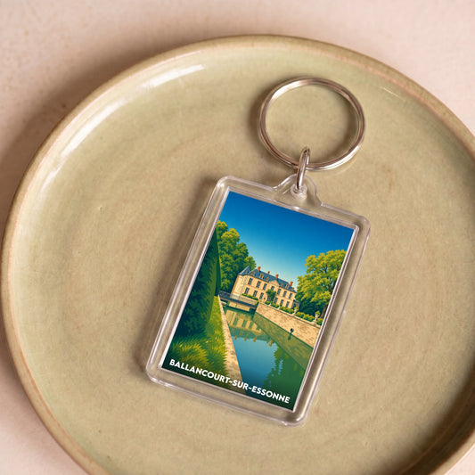 Porte-clés souvenir de la ville de Ballancourt-sur-Essonne avec une illustration stylisée.