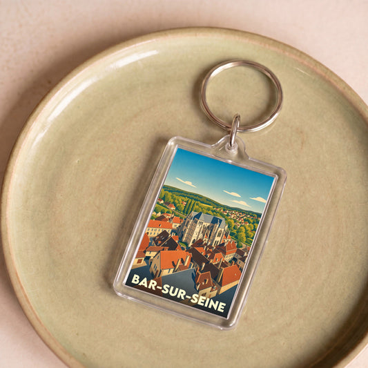 Porte-clés souvenir de la ville de Bar-sur-Seine avec une illustration stylisée.