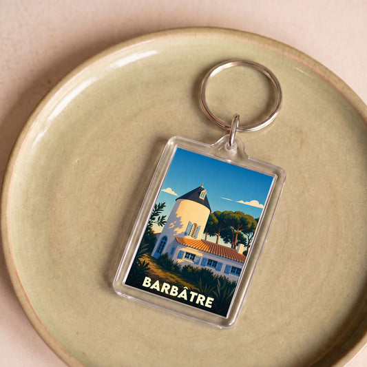 Porte-clés souvenir de la ville de Barbâtre avec une illustration stylisée d'un moulin blanc.
