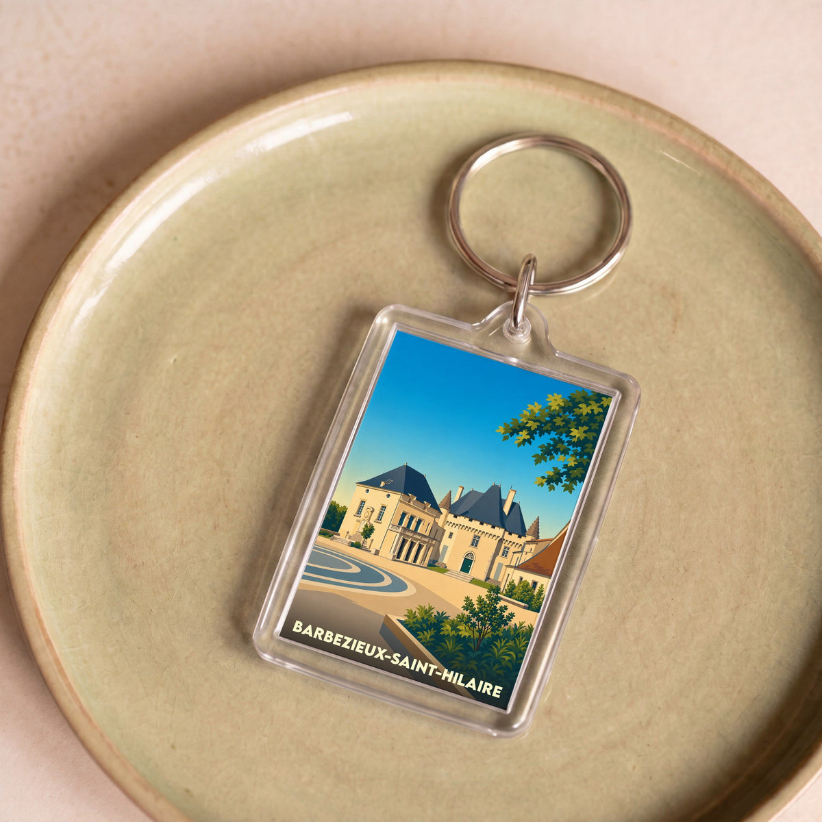 Porte-clés souvenir de la ville de Barbezieux-Saint-Hilaire avec une illustration stylisée de son château.