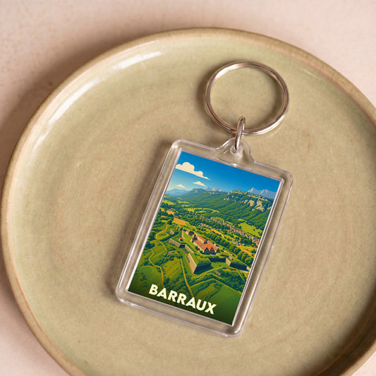 Porte-clés souvenir de la ville de Barraux avec une illustration stylisée du fort et des montagnes environnantes.