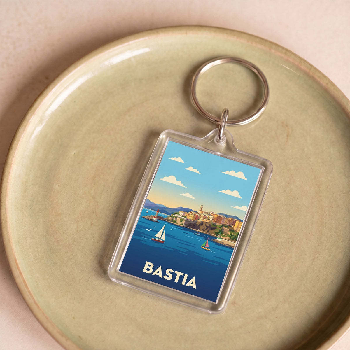 Porte-clés souvenir de la ville de Bastia avec une illustration stylisée.