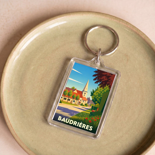 Porte-clés souvenir de la ville de Baudrières avec une illustration stylisée et colorée.