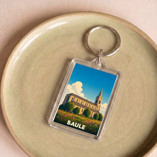 Porte-clés souvenir de la ville de Baule avec une illustration stylisée d'une église.