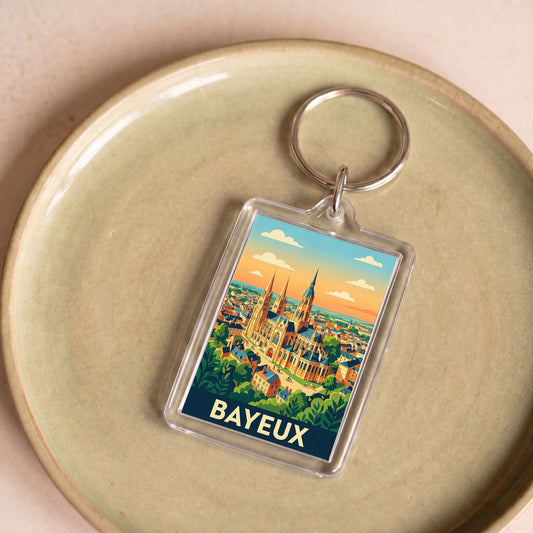 Porte-clés souvenir de la ville de Bayeux avec une illustration stylisée.