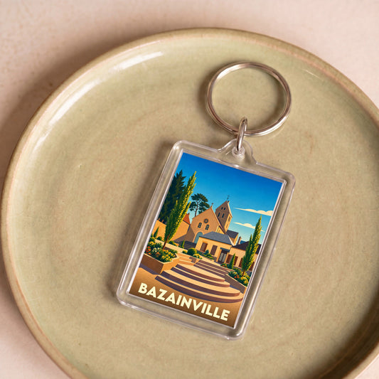 Porte-clés souvenir de la ville de Bazainville avec une illustration stylisée de son église.
