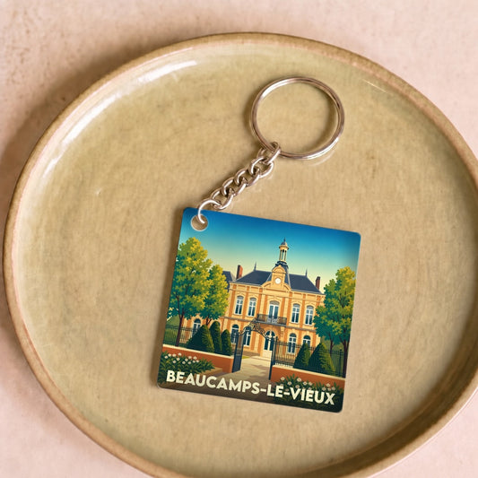Porte-clés souvenir de Beaucamps-le-Vieux avec une illustration stylisée de l'hôtel de ville.