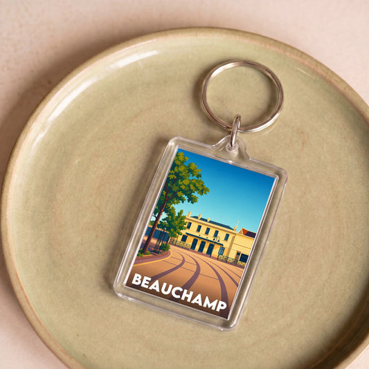 Porte-clés souvenir de la ville de Beauchamp avec une illustration stylisée de sa gare.