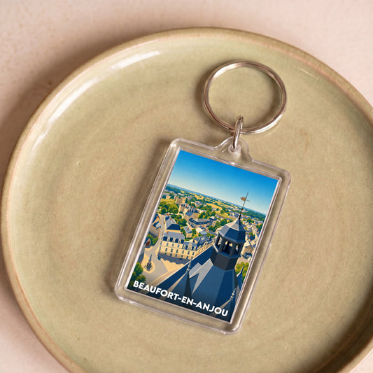 Porte-clés souvenir de la ville de Beaufort-en-Anjou avec une illustration stylisée.