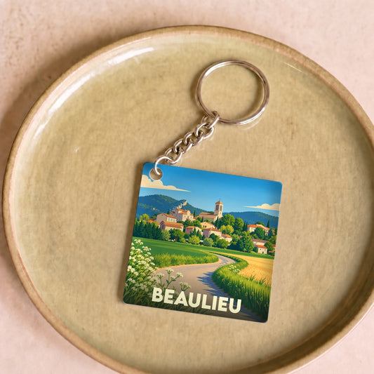 Porte-clés souvenir de la ville de Beaulieu avec une illustration stylisée d'un paysage de campagne.