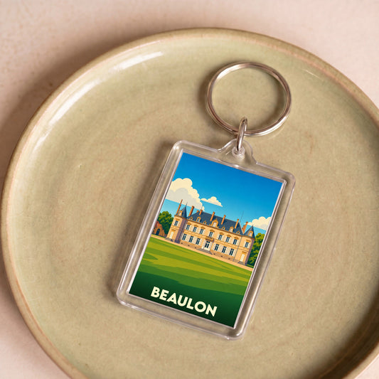 Porte-clés souvenir de la ville de Beaulon avec une illustration stylisée de château.