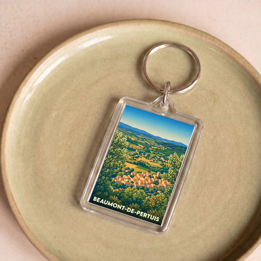 Porte-clés souvenir de la ville de Beaumont-de-Pertuis avec une illustration stylisée d'un village provençal.