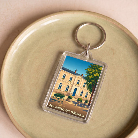 Porte-clés souvenir de la ville de Beaumont-du-Gâtinais avec une illustration stylisée de sa mairie.