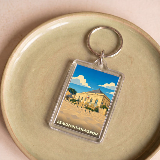 Porte-clés souvenir de la ville de Beaumont-en-Véron avec une illustration stylisée.