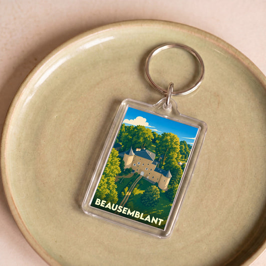 Porte-clés souvenir de la ville de Beausemblant avec une illustration stylisée de son château.
