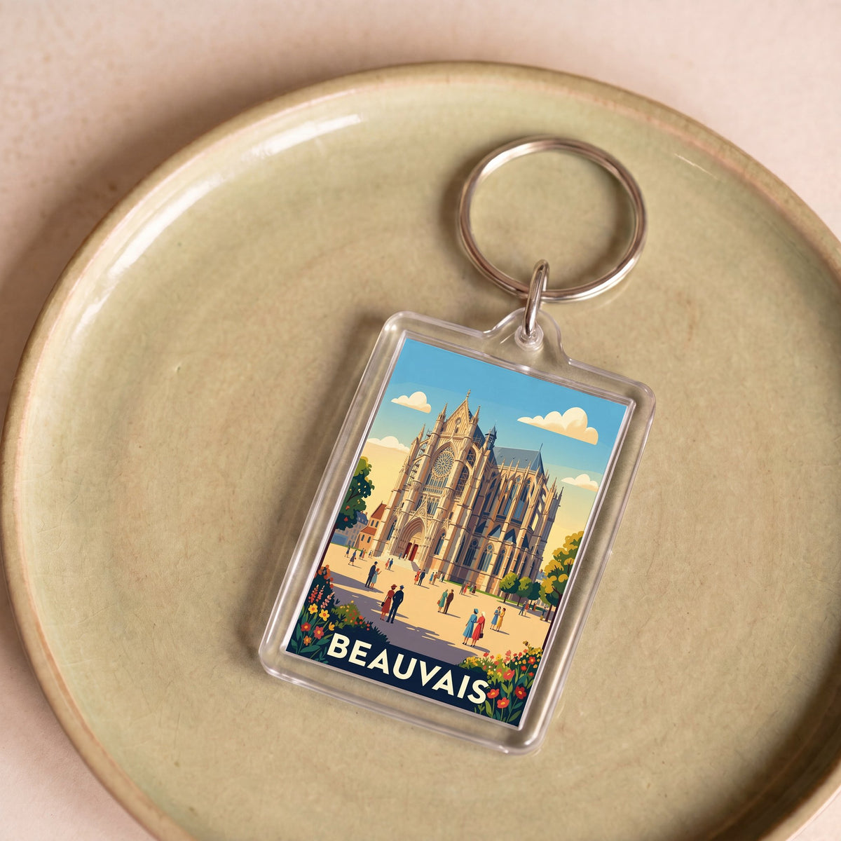 Porte-clés souvenir de la ville de Beauvais avec une illustration stylisée de sa cathédrale.