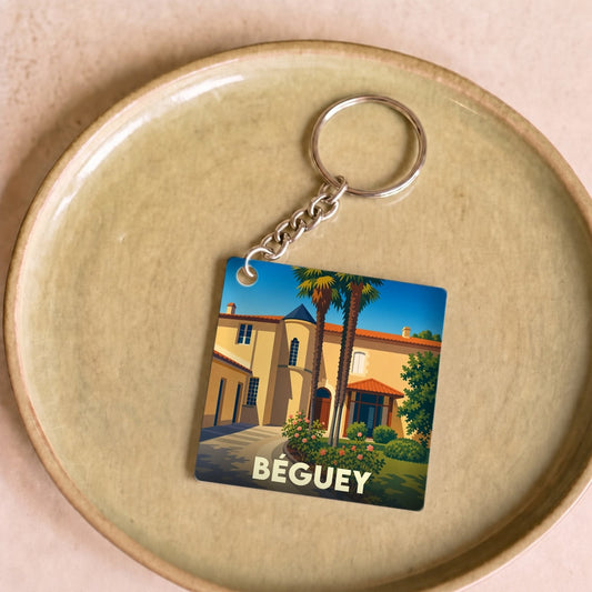 Porte-clés souvenir de la ville de Béguey avec une illustration stylisée.