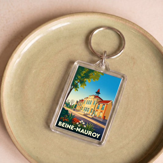 Porte-clés souvenir de la ville de Beine-Nauroy avec une illustration stylisée.