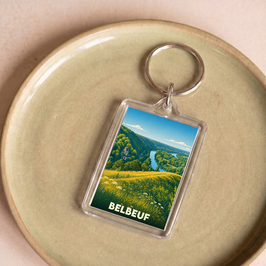 Porte-clés souvenir de la ville de Belbeuf avec une illustration stylisée d'un paysage naturel.