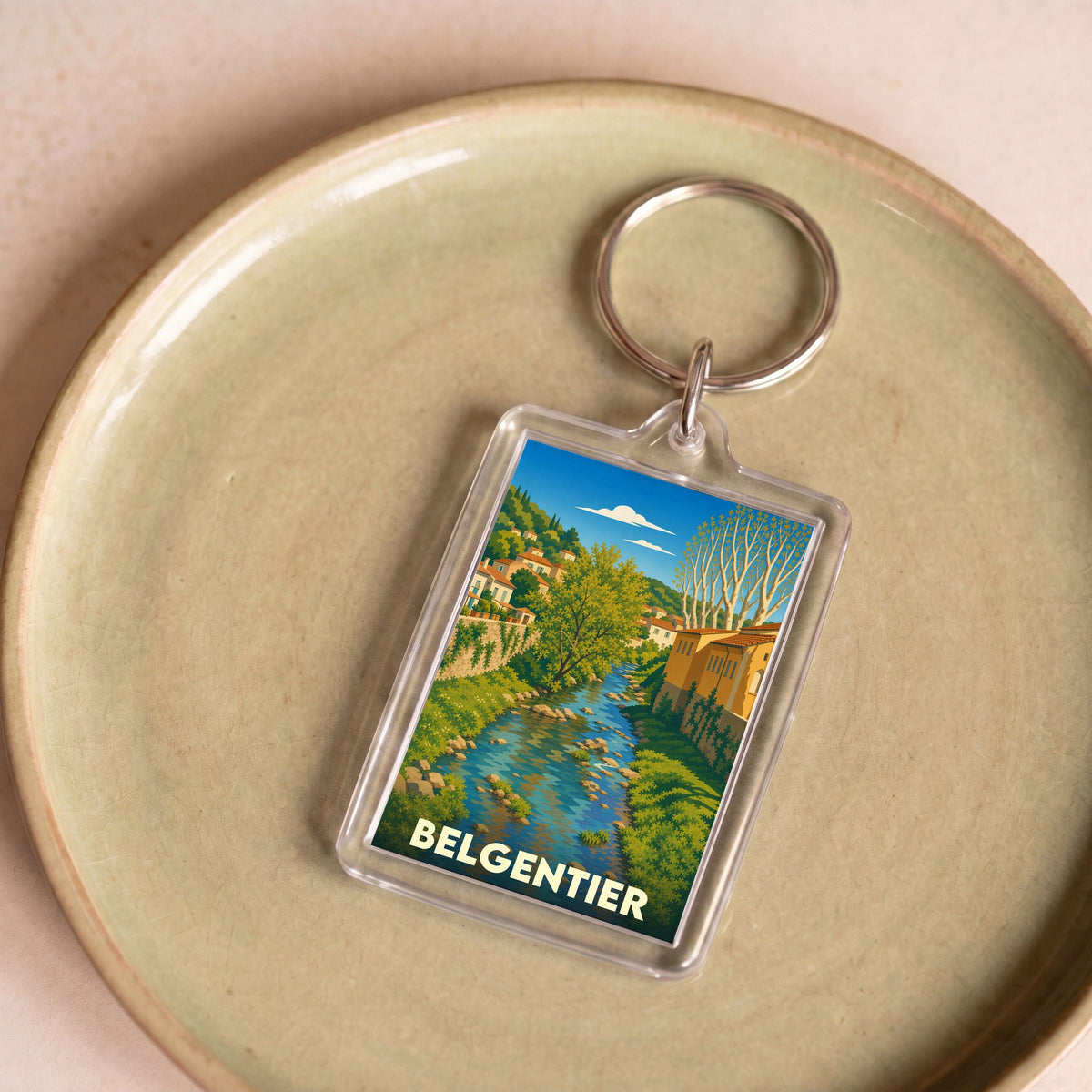 Porte-clés souvenir de la ville de Belgentier avec une illustration stylisée d'un cours d'eau.