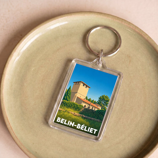 Porte-clés souvenir de la ville de Belin-Béliet avec une illustration stylisée.