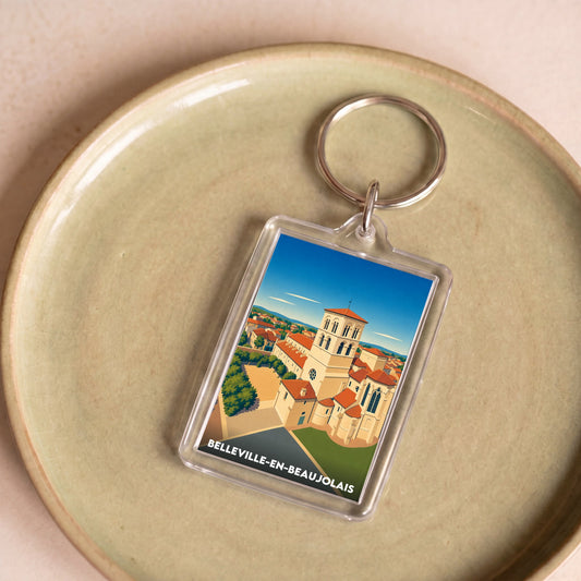 Porte-clés souvenir de la ville de Belleville-en-Beaujolais avec une illustration stylisée.