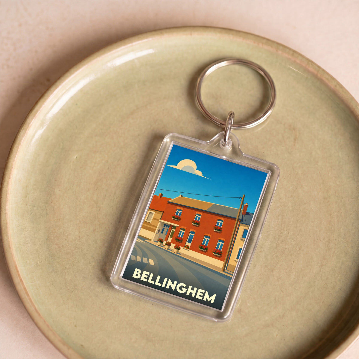 Porte-clés souvenir de la ville de Bellinghem avec une illustration stylisée.