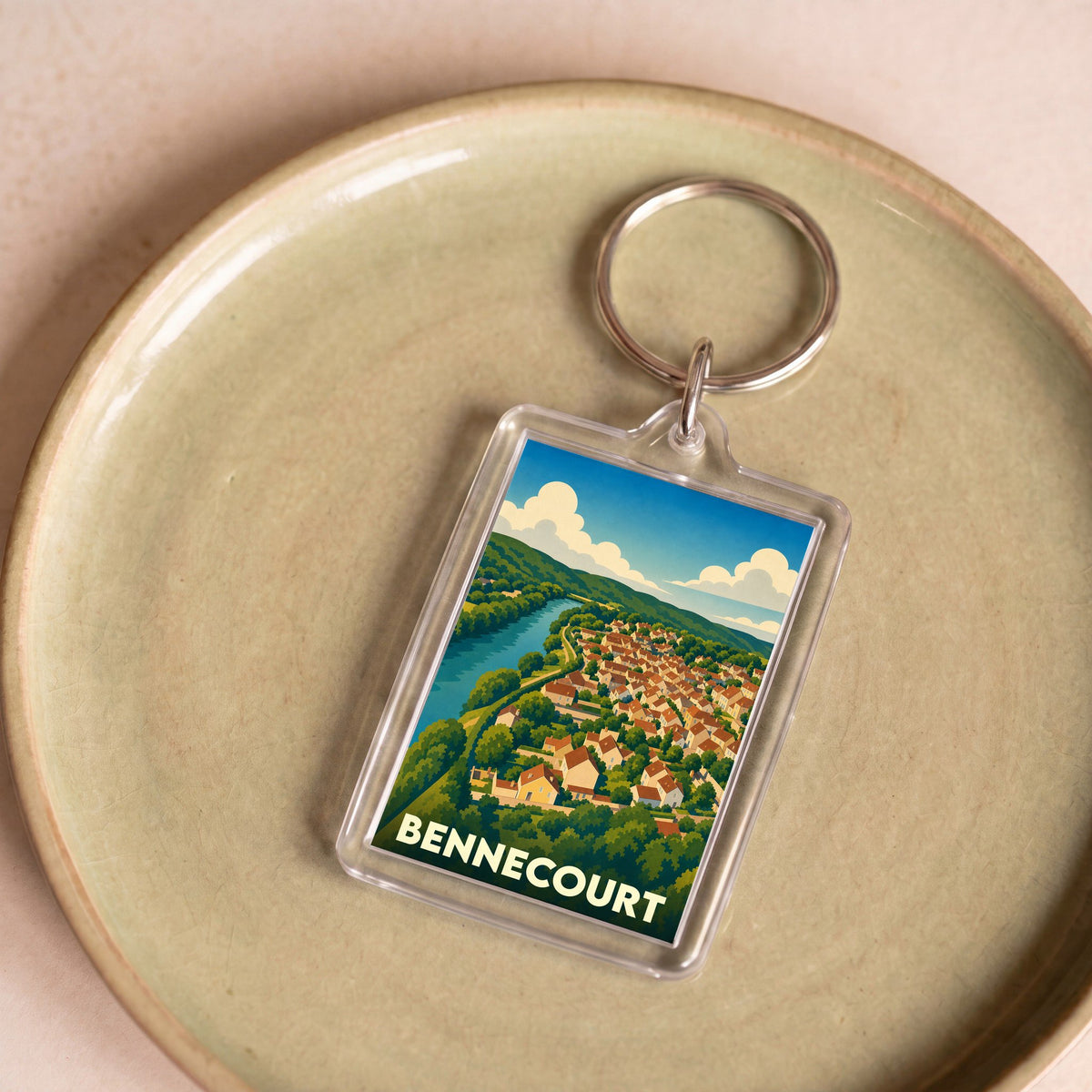 Porte-clés souvenir de la ville de Bennecourt avec une illustration stylisée.