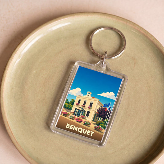 Porte-clés souvenir de la ville de Benquet avec une illustration stylisée.