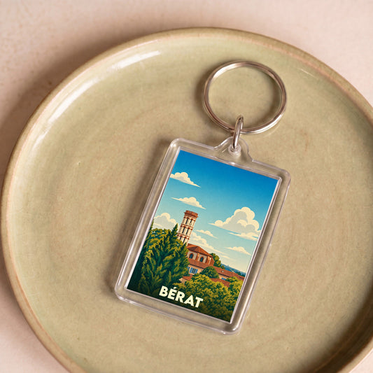 Porte-clés souvenir de la ville de Bérat avec une illustration stylisée.