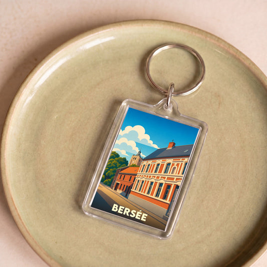 Porte-clés souvenir de la ville de Bersée avec une illustration stylisée de ses bâtiments.