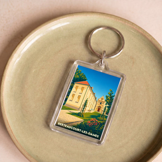 Porte-clés souvenir de la ville de Berteaucourt-les-Dames avec une illustration stylisée.