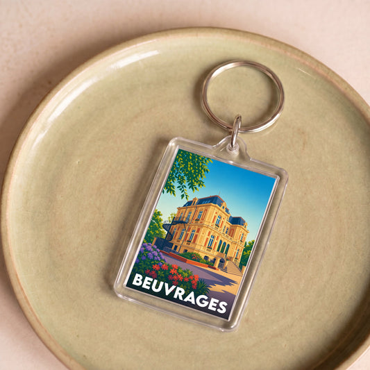Porte-clés souvenir de la ville de Beuvrages avec une illustration stylisée d'un bâtiment historique.