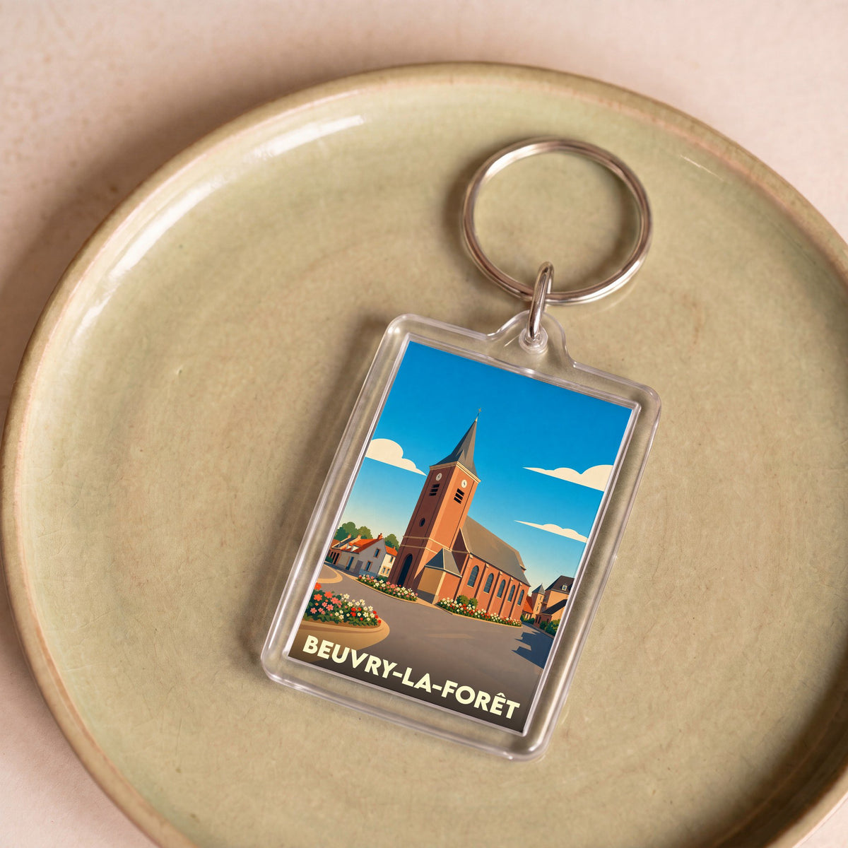 Porte-clés souvenir de la ville de Beuvry-la-Forêt avec une illustration stylisée de son église.