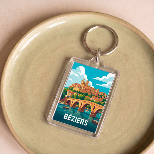 Porte-clés souvenir de la ville de Béziers avec une illustration stylisée.
