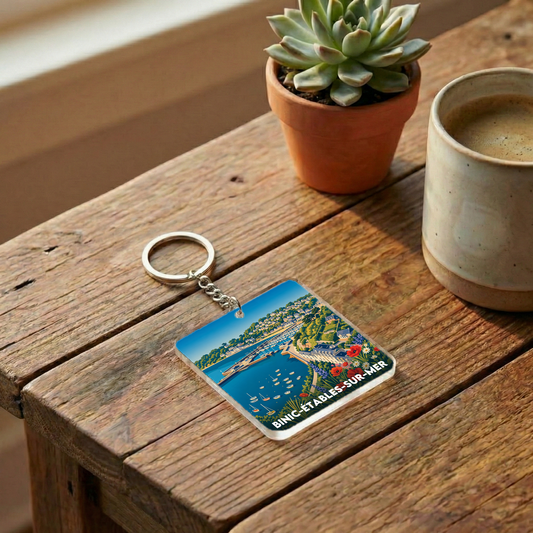 Porte-clés souvenir de la ville de Binic-Étables-sur-Mer avec une illustration stylisée.